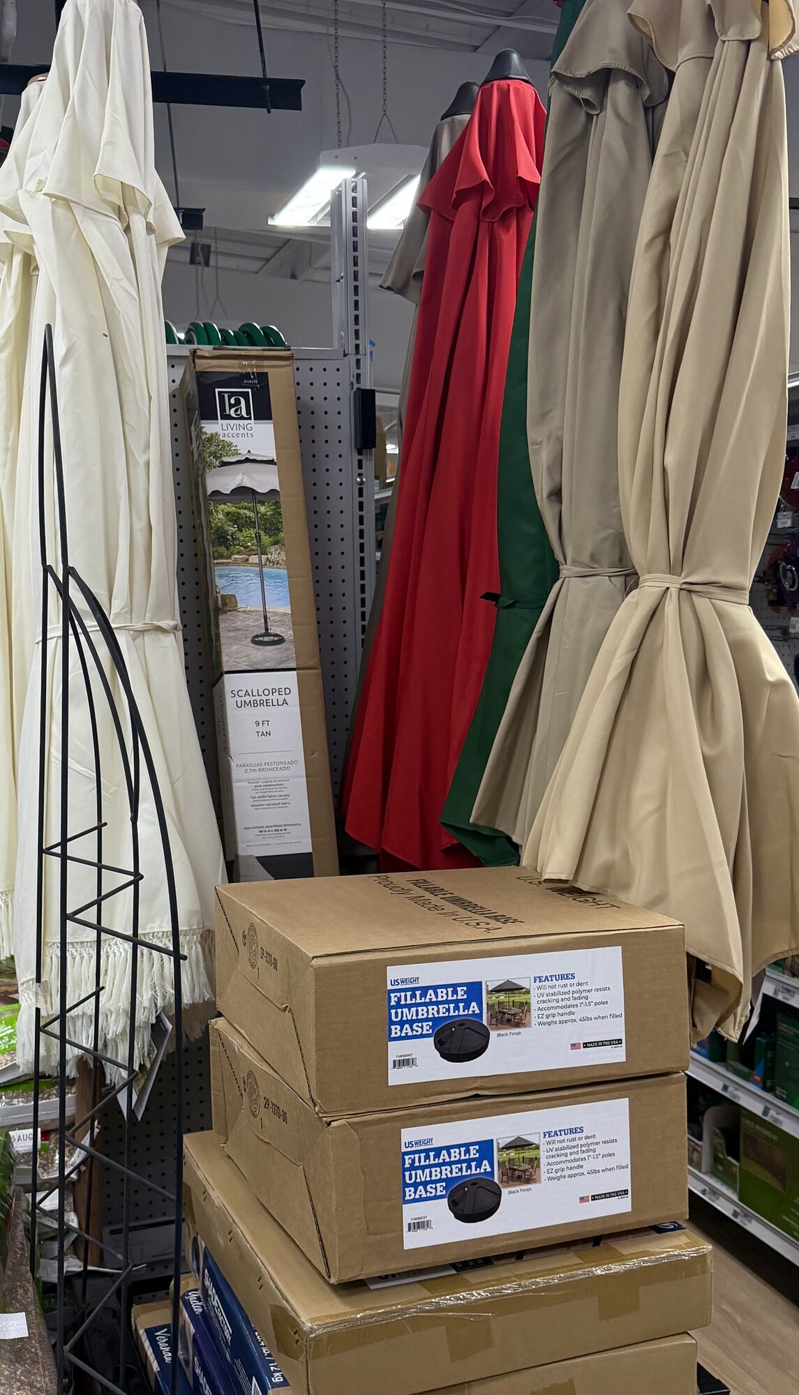 Living Accents scalloped patio umbrellas and fillable umbrella bases at Hessler Paint & Hardware in Delray Beach, Florida.