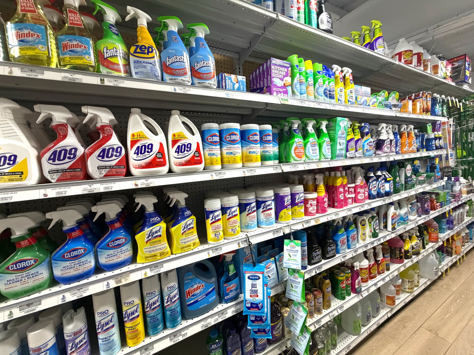 Shelves of Clorox, Lysol, 409 and Windex cleaners and disinfectant wipes