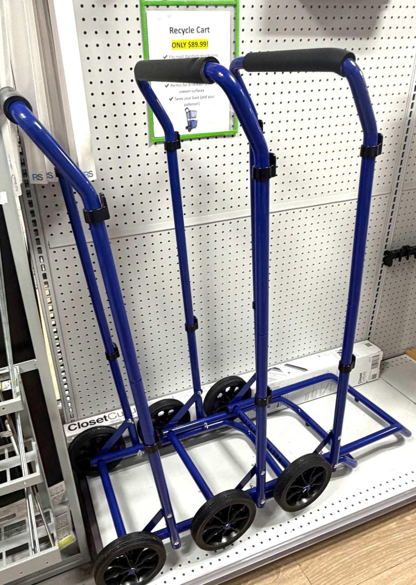 Blue folding recycle carts and hand trucks with large wheels on display in Delray Beach